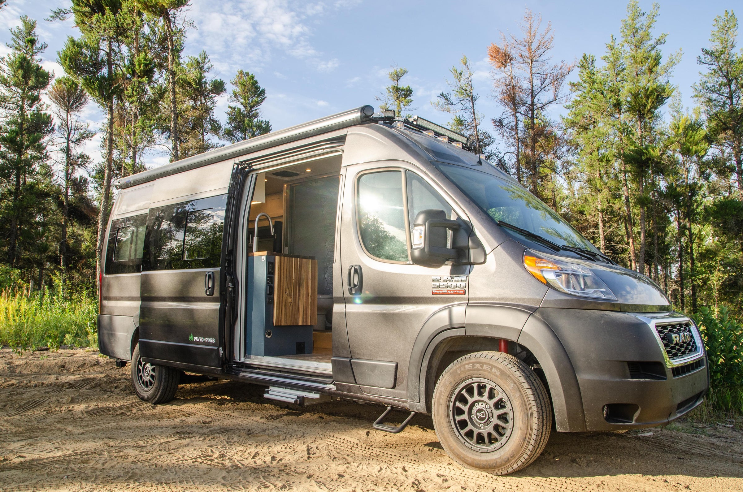 Promaster van conversion with black rhino rims and custom interior